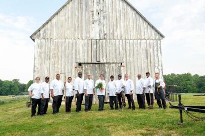 Dining Services chefs outside a barn