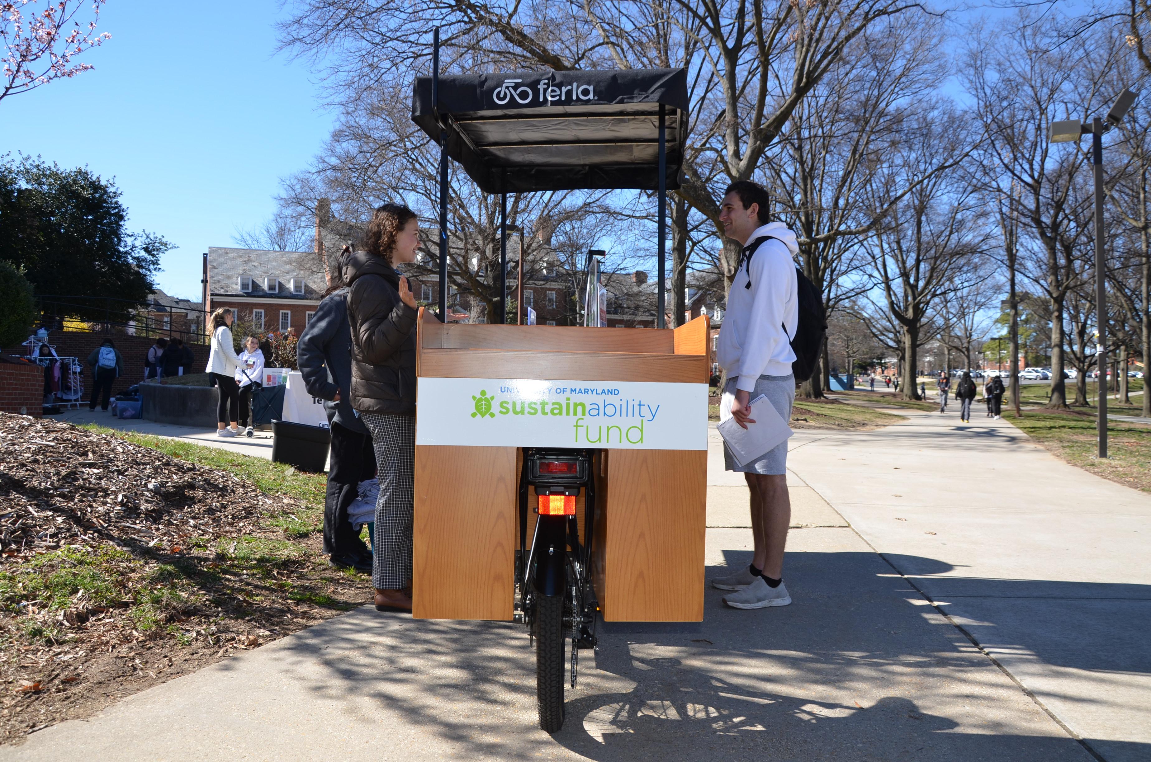 Students talking to OS staff at the Outreach Bike