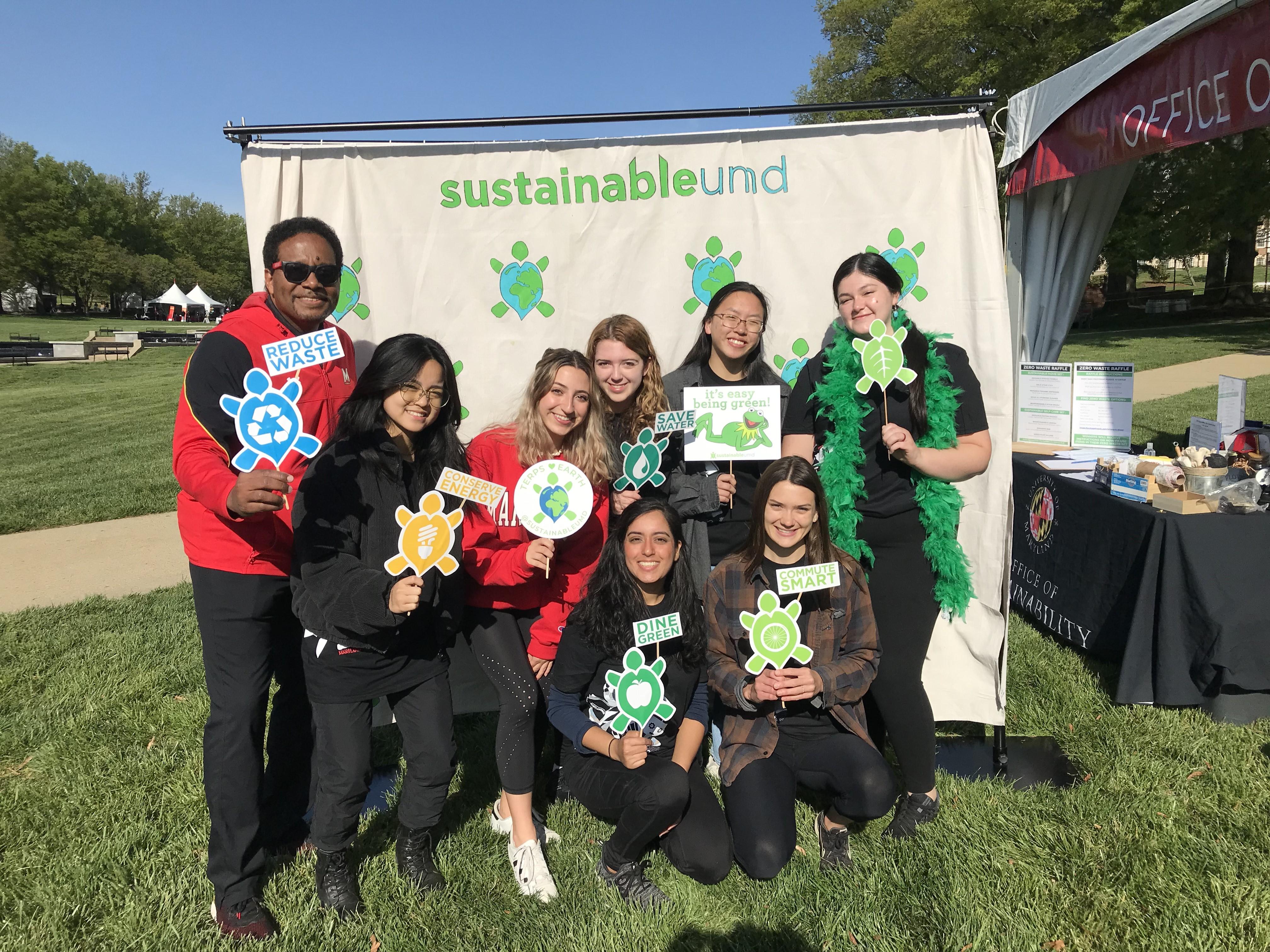 Students and staff pose with Pres. Pines with turtles