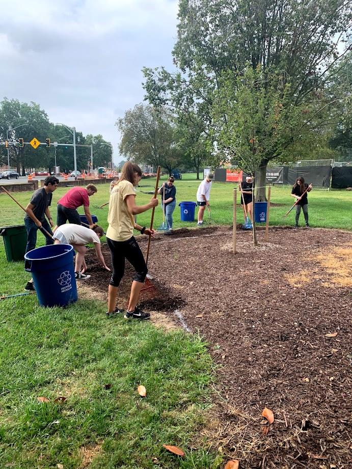 Students doing yard work with UMD Arboretum