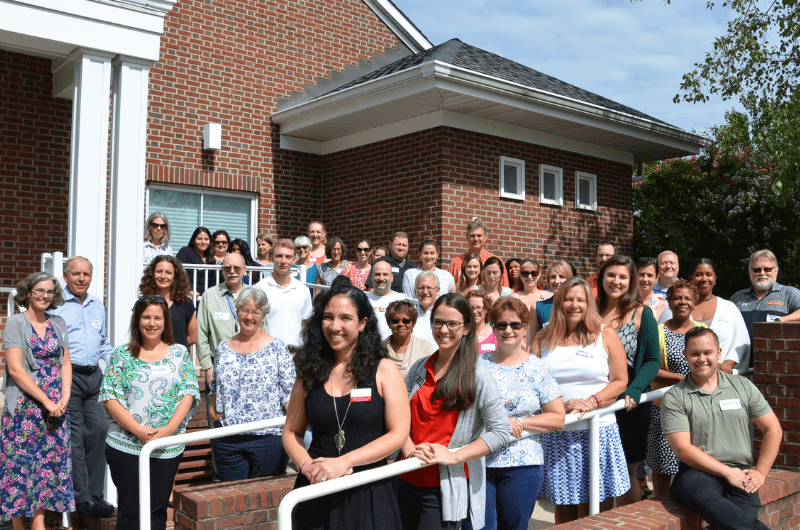 Staff gather for photo outside