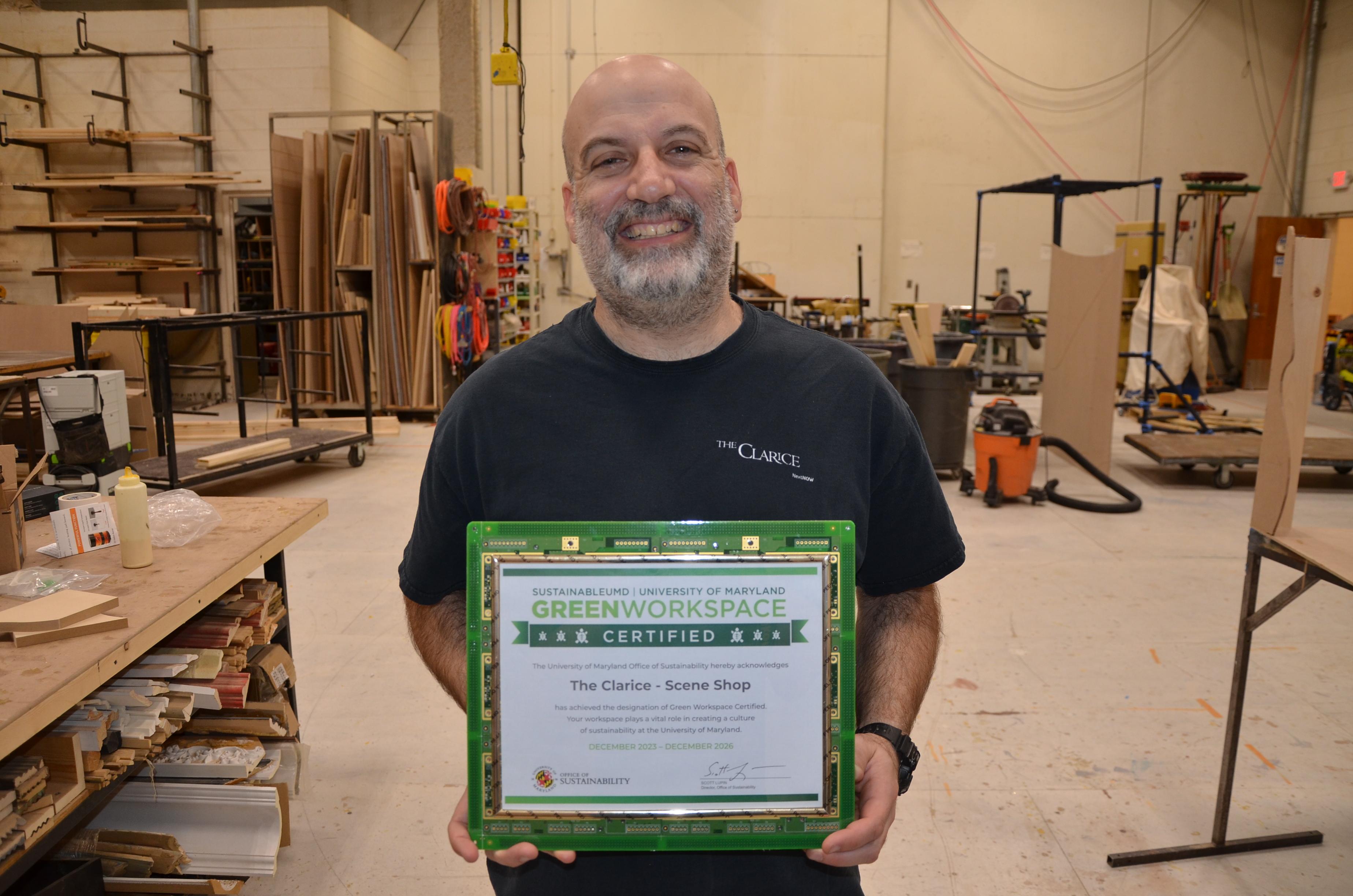 Scene Shop Staff Holding Green Workspace Certificate