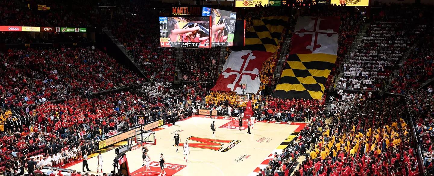 Image of xfinity center during a basketball game when the Maryland flag comes down