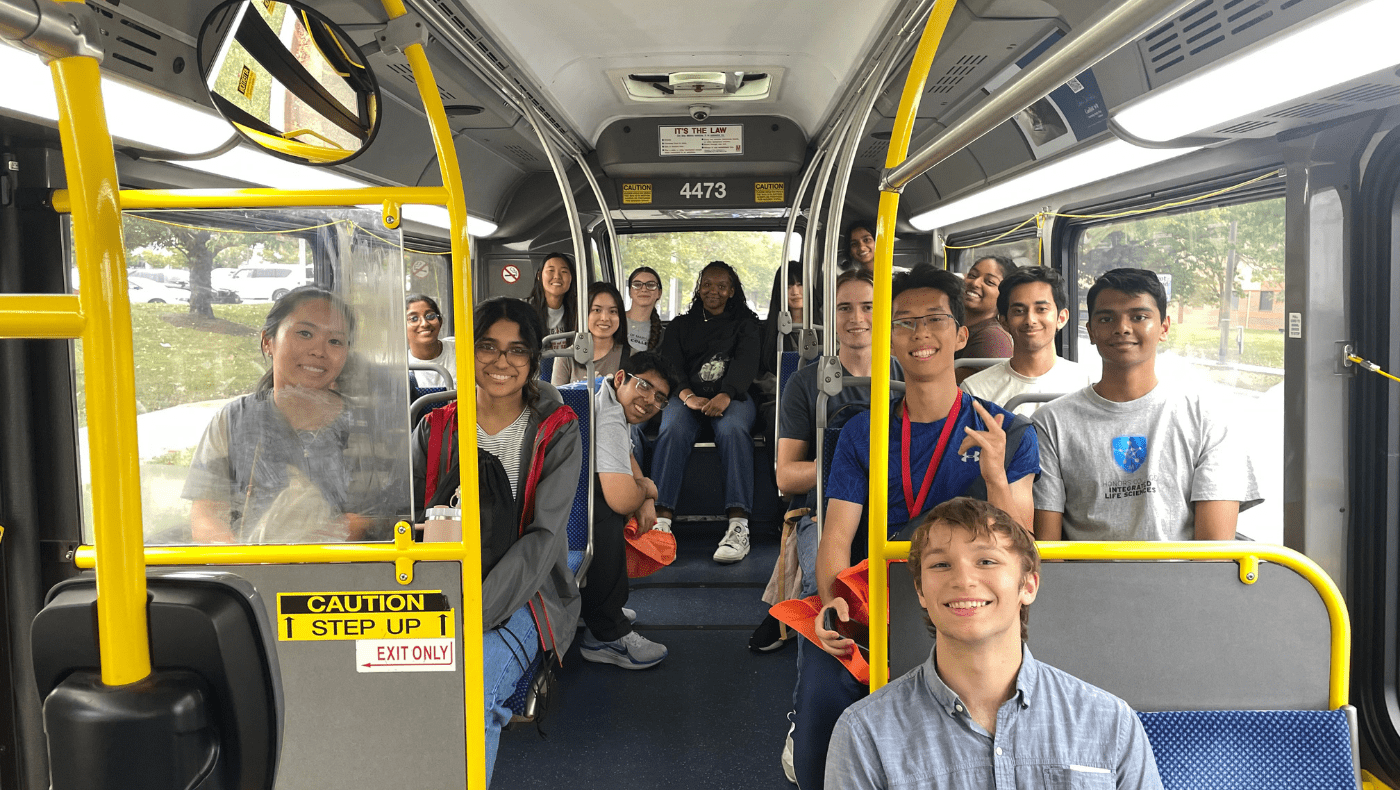 Many students riding on a bus