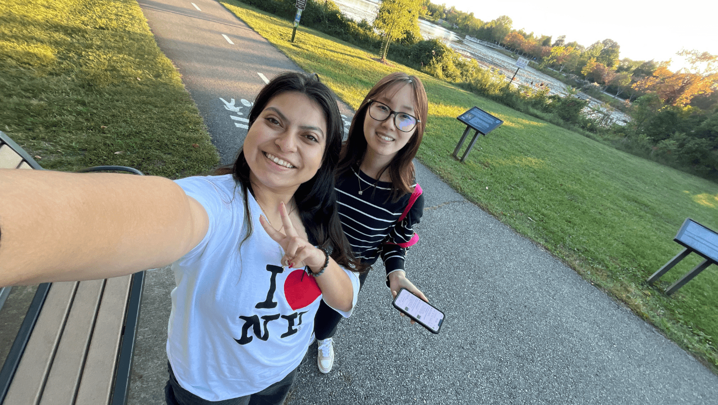 2 students posing on a walking trail