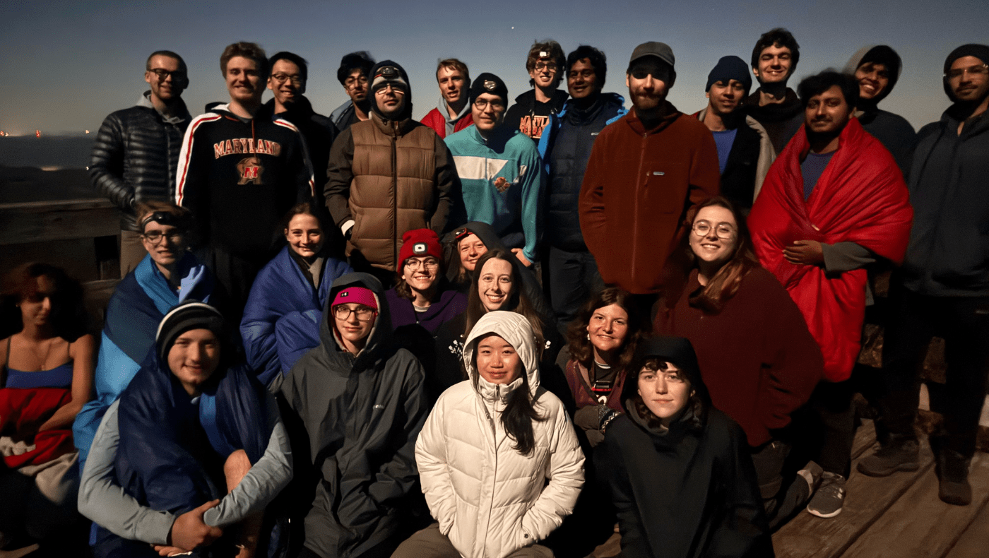 Many students posing for a picture while hiking
