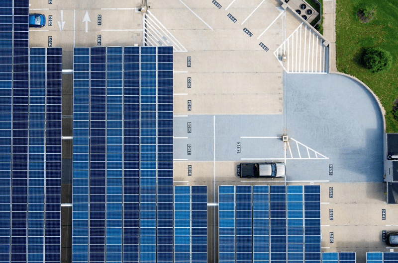 Ariel view of solar panels on top of a parking garage 