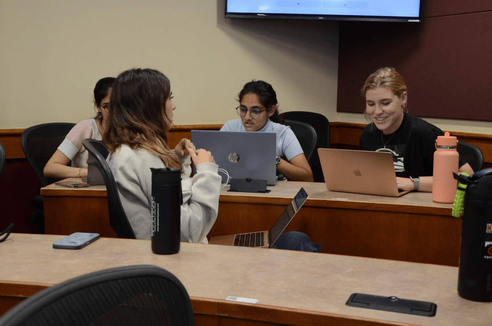 Students working in small teams on their portfolios